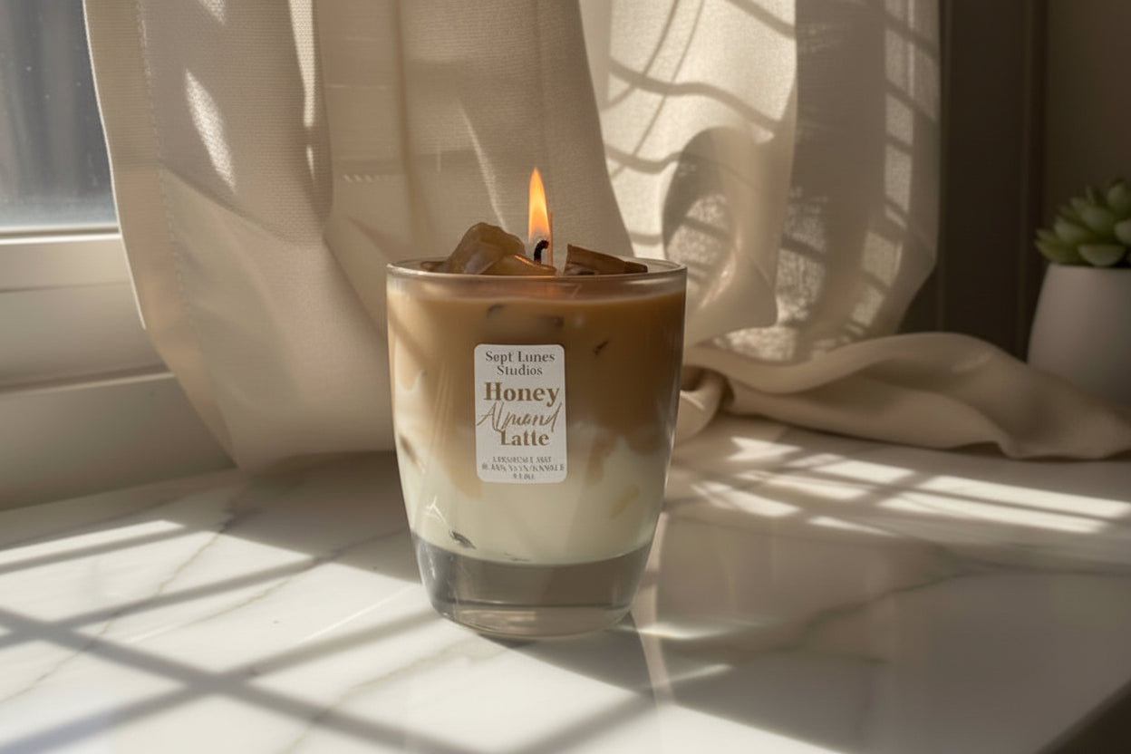 Candle in a glass jar with a label on a light surface, draped with sheer curtains.